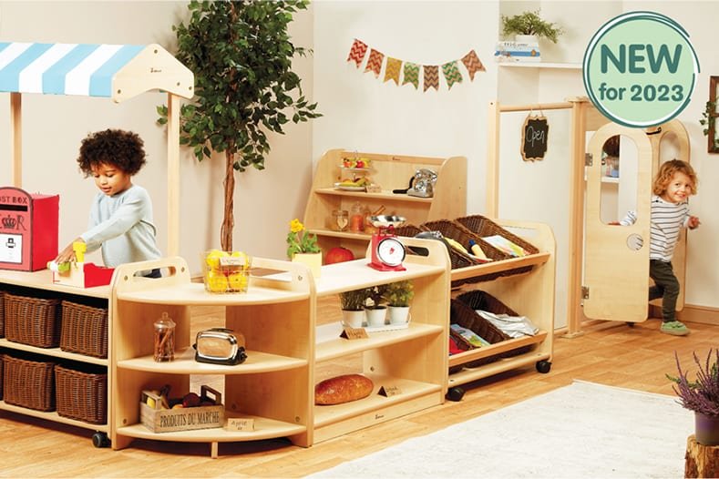 Children playing with wooden kitchen stand